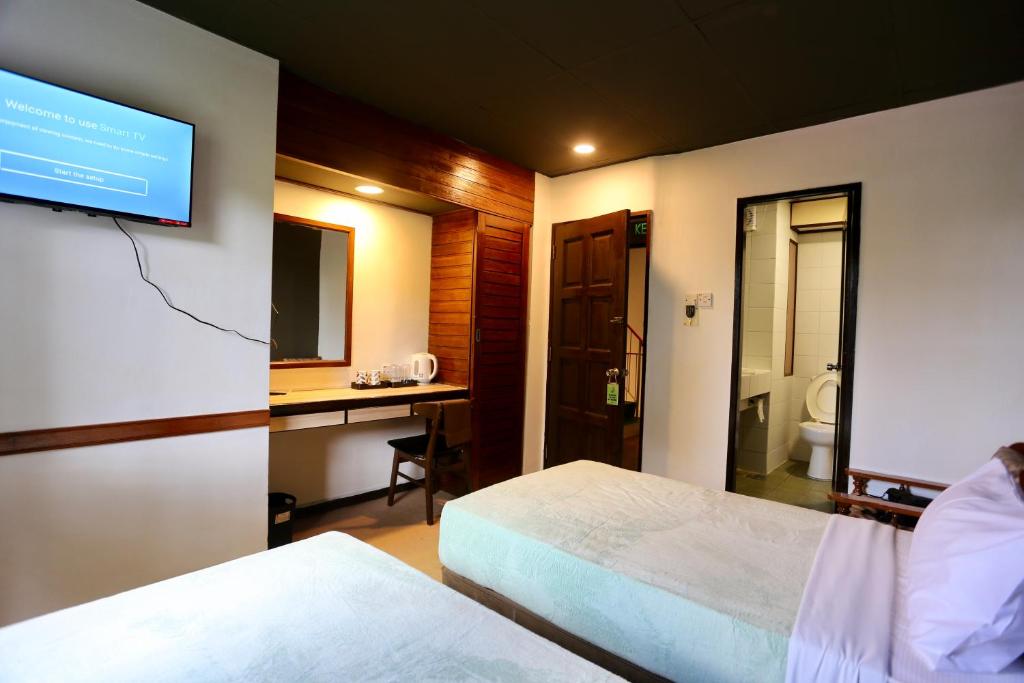 Postel nebo postele na pokoji v ubytování Fata Hotel by Project Borneo