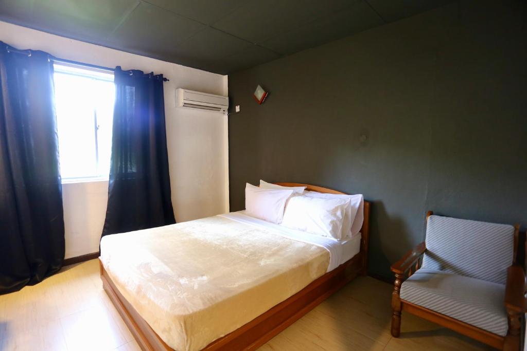 Postel nebo postele na pokoji v ubytování Fata Hotel by Project Borneo