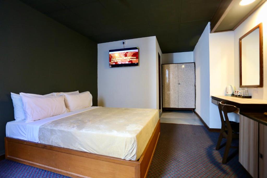Postel nebo postele na pokoji v ubytování Fata Hotel by Project Borneo