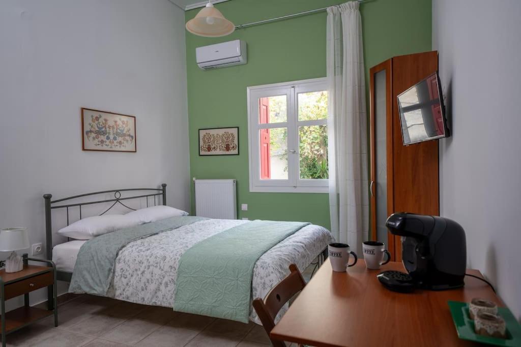 Postel nebo postele na pokoji v ubytování Delphian Colors - Green Edition