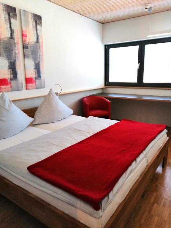 Postel nebo postele na pokoji v ubytování Bed & Breakfast Rotes Haus