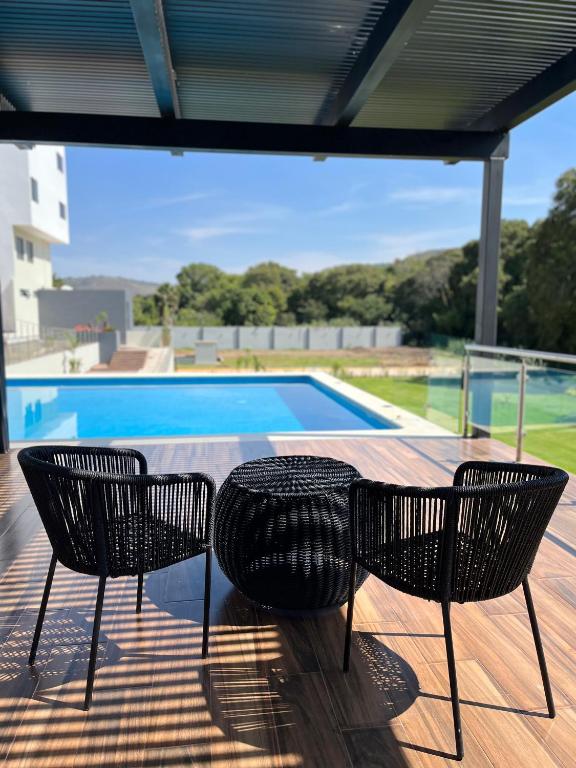 Bazén v ubytování Hotel Cinco Diamantes nebo v jeho okolí