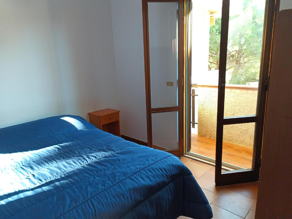 Cama ou camas em um quarto em Villaggio La Bahia