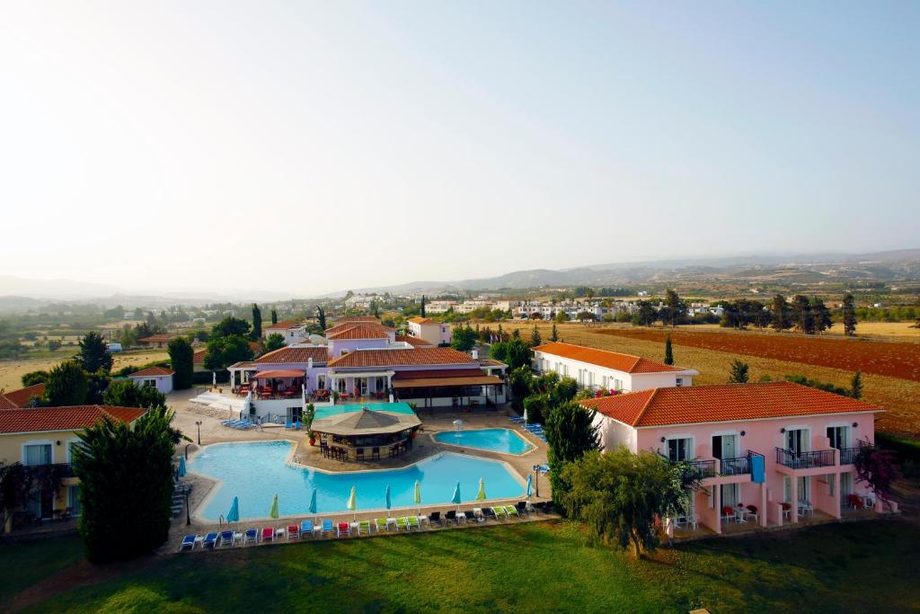 an aerial view of a resort with a swimming pool at Akamanthea Holiday Village in Polis Chrysochous