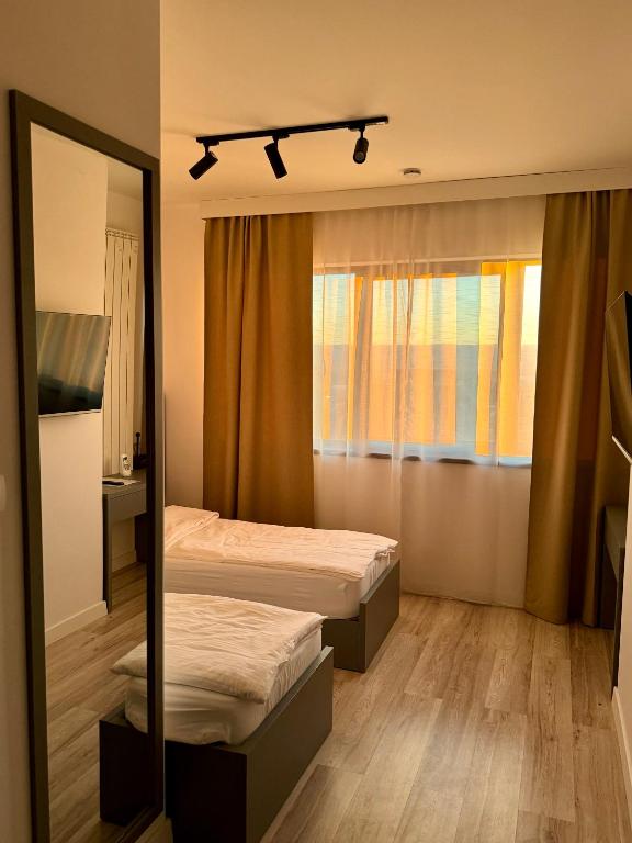 Postel nebo postele na pokoji v ubytování Escape Pensiune