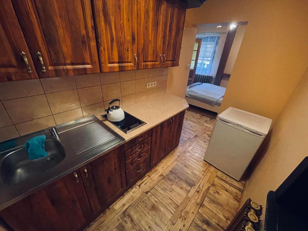 an overhead view of a kitchen with a sink and a refrigerator at Willa Maria in Kościelisko