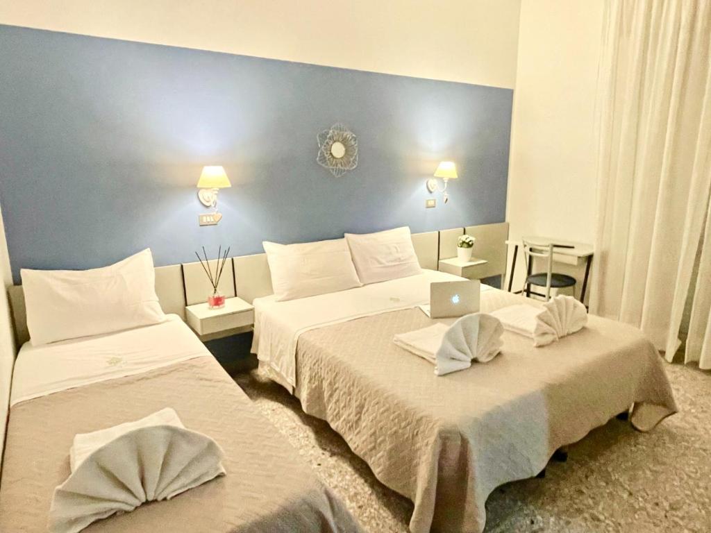 Postel nebo postele na pokoji v ubytování Hotel Alfa anche con SPIAGGIA INCLUSA