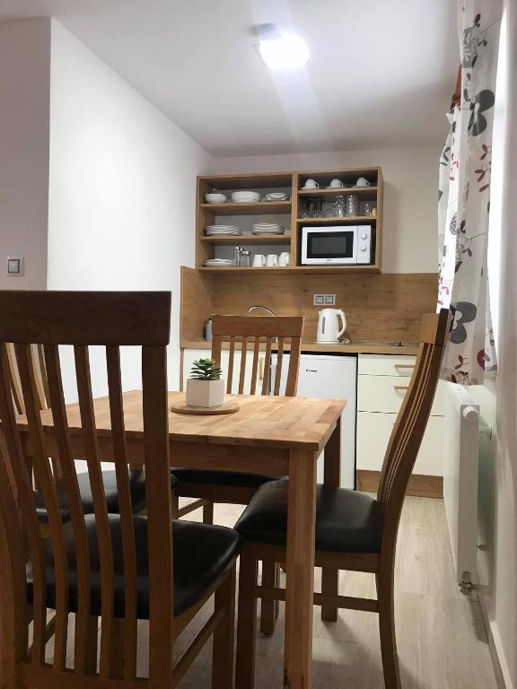 Kuchyň nebo kuchyňský kout v ubytování Apartmány v Chalupě nad Modravou