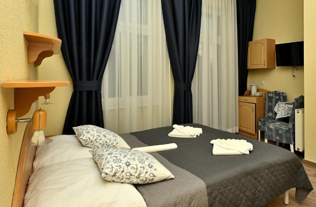 Postel nebo postele na pokoji v ubytování Villa Casteria