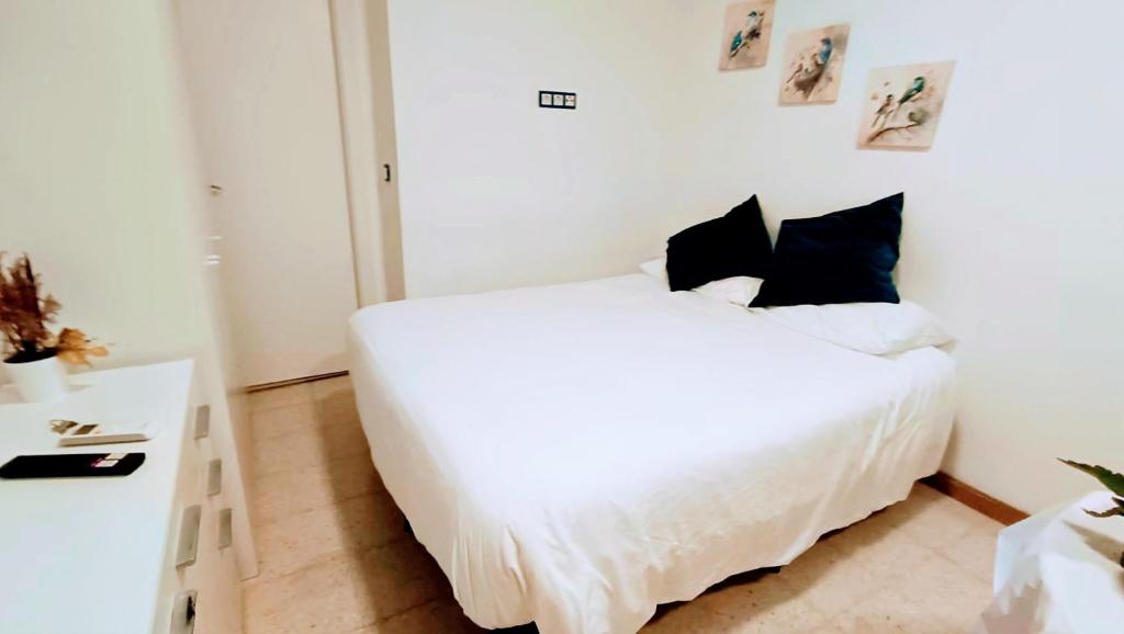 Postel nebo postele na pokoji v ubytování Hostal Estudios