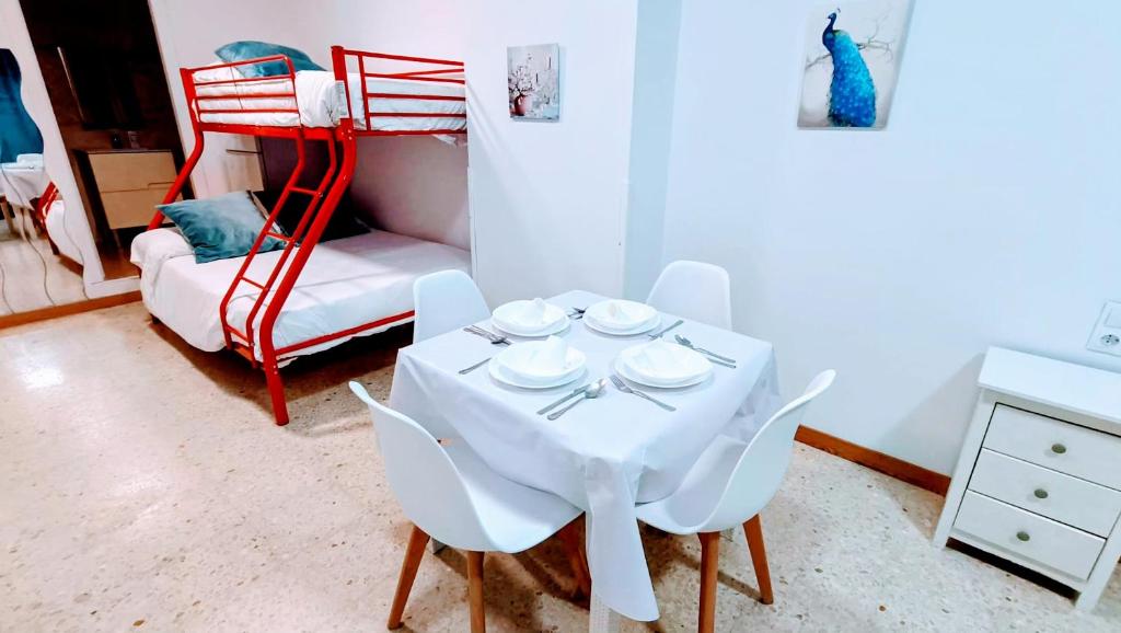 Postel nebo postele na pokoji v ubytování Hostal Estudios