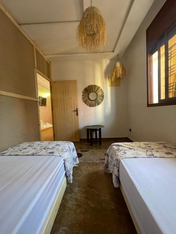 Postel nebo postele na pokoji v ubytování ASNFU AUBERGe