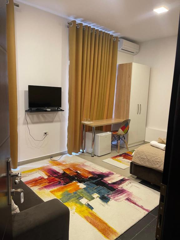 TV a/nebo společenská místnost v ubytování Ora Apartament
