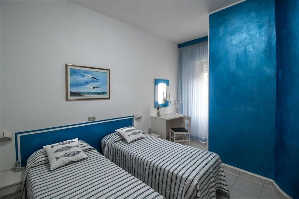 Postel nebo postele na pokoji v ubytování Hotel Corallo