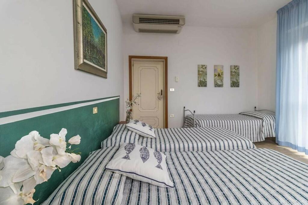 Postel nebo postele na pokoji v ubytování Hotel Corallo