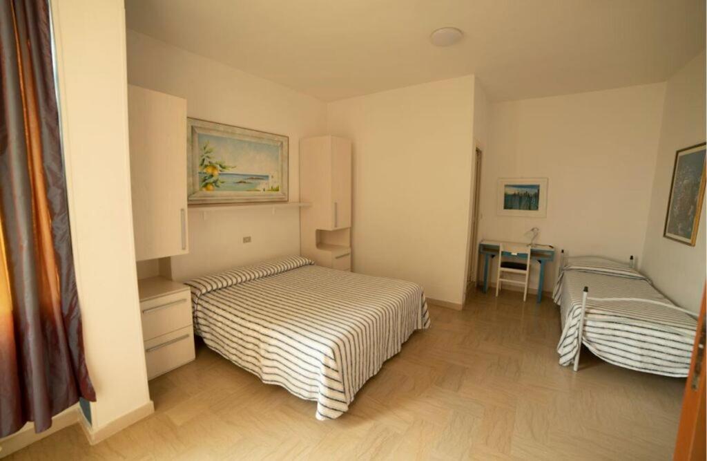 Postel nebo postele na pokoji v ubytování Hotel Corallo