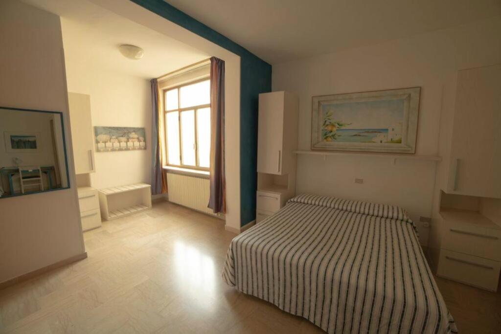 Postel nebo postele na pokoji v ubytování Hotel Corallo