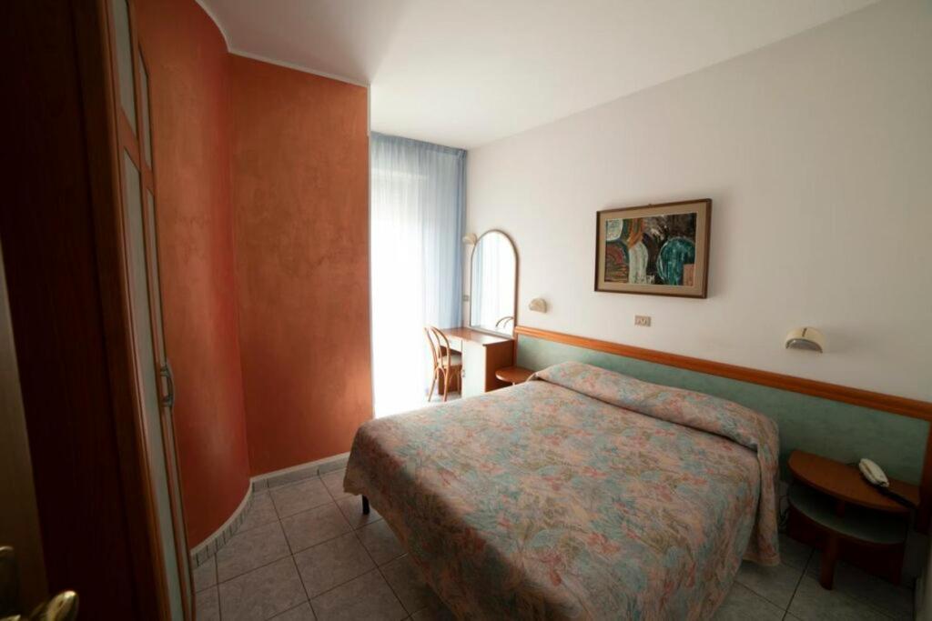 Postel nebo postele na pokoji v ubytování Hotel Corallo