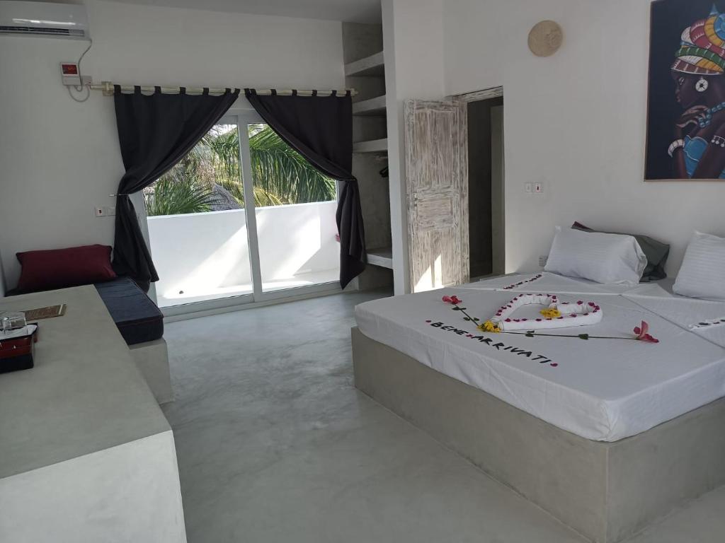 Postel nebo postele na pokoji v ubytování Watamu Ascot Resort
