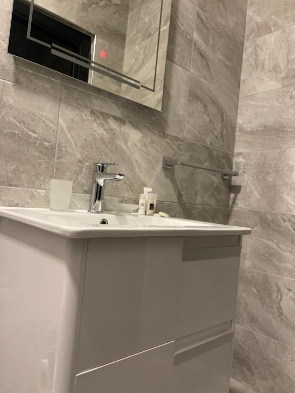 Koupelna v ubytování Ora Apartament