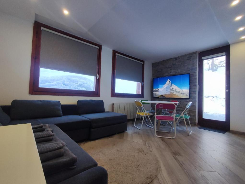 Televízia a/alebo spoločenská miestnosť v ubytovaní Aqua Apartment - very Ski In & Ski Out CIR 0436