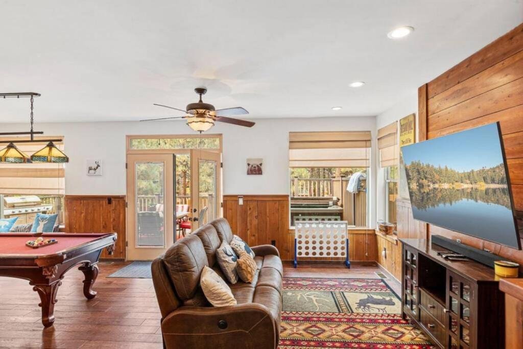 a living room with a pool table and a tv at Knoll Lake Cabin in Big Bear Lake in Big Bear Lake