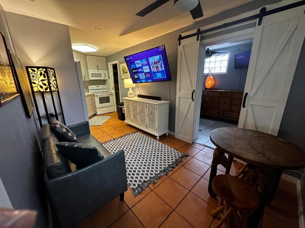 an overhead view of a living room with a television at Cottage in Stock Island in Key West