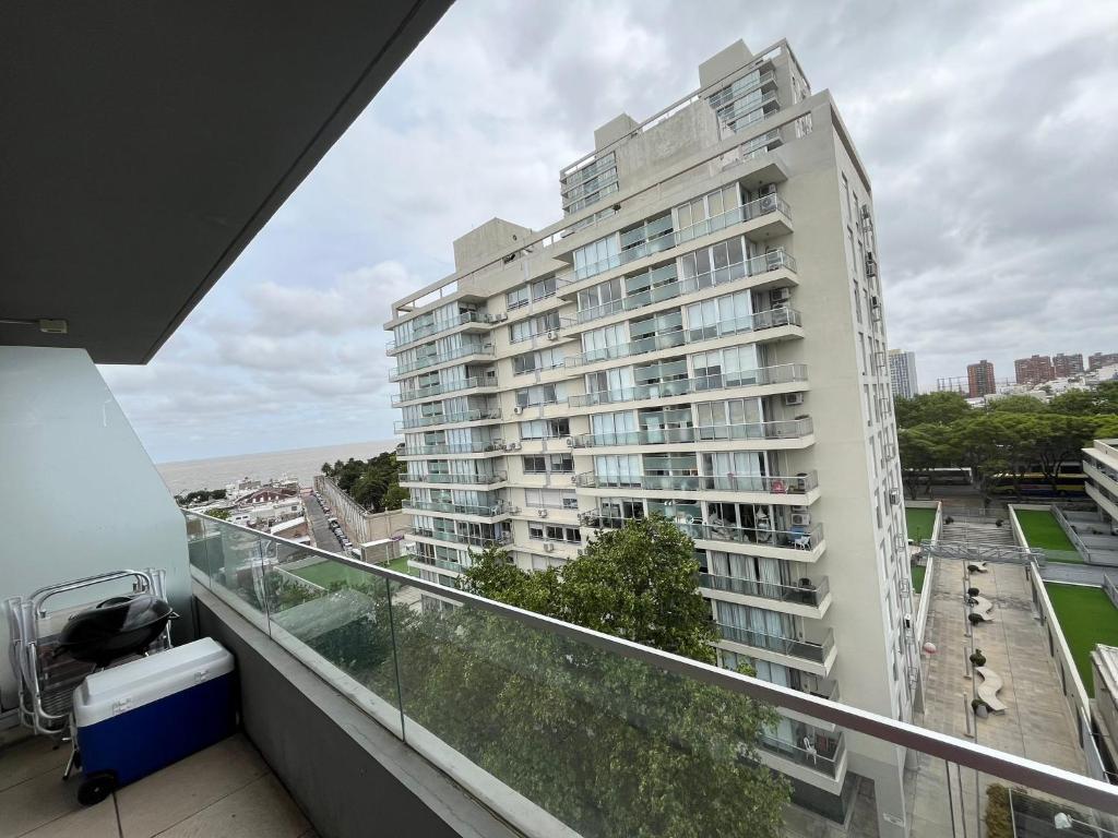 a balcony with a view of a large building at Buena vista y locacion in Montevideo