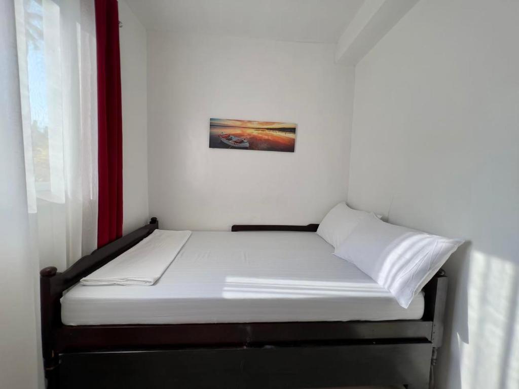 Postel nebo postele na pokoji v ubytování Batis ni Juan Leisureland