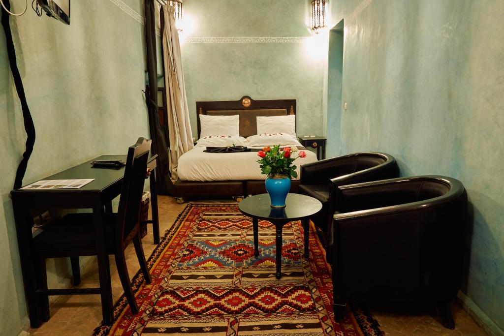 Postel nebo postele na pokoji v ubytování Riad Dar La Rose