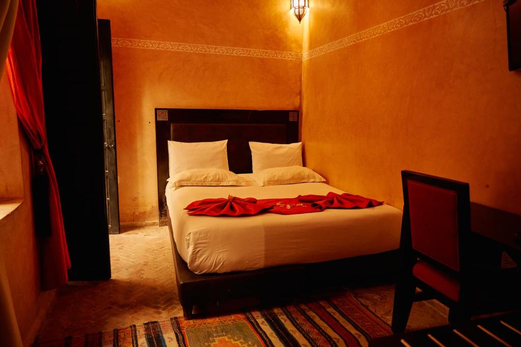 Postel nebo postele na pokoji v ubytování Riad Dar La Rose