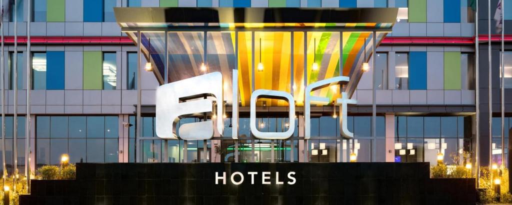 a large hotel sign in front of a building at Aloft Memphis Downtown in Memphis