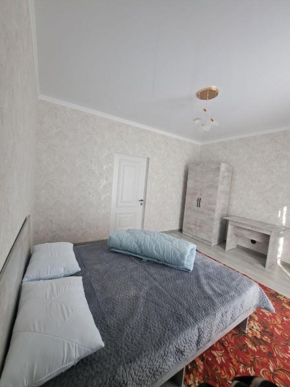 Postel nebo postele na pokoji v ubytování GuestHouse "ERKIN"