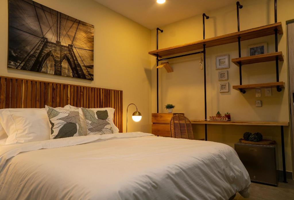 Een bed of bedden in een kamer bij Sensacional Suite Boutique en Cartagena
