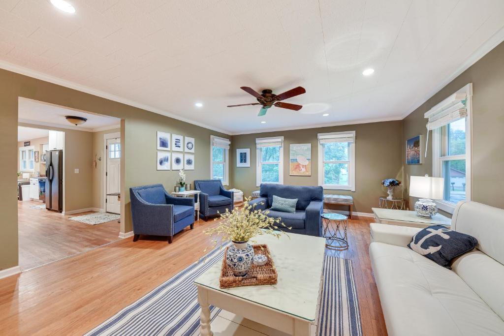 a living room with a couch and a ceiling fan at Family-Friendly Twin Lakes Home Near Lake Mary! in Twin Lakes