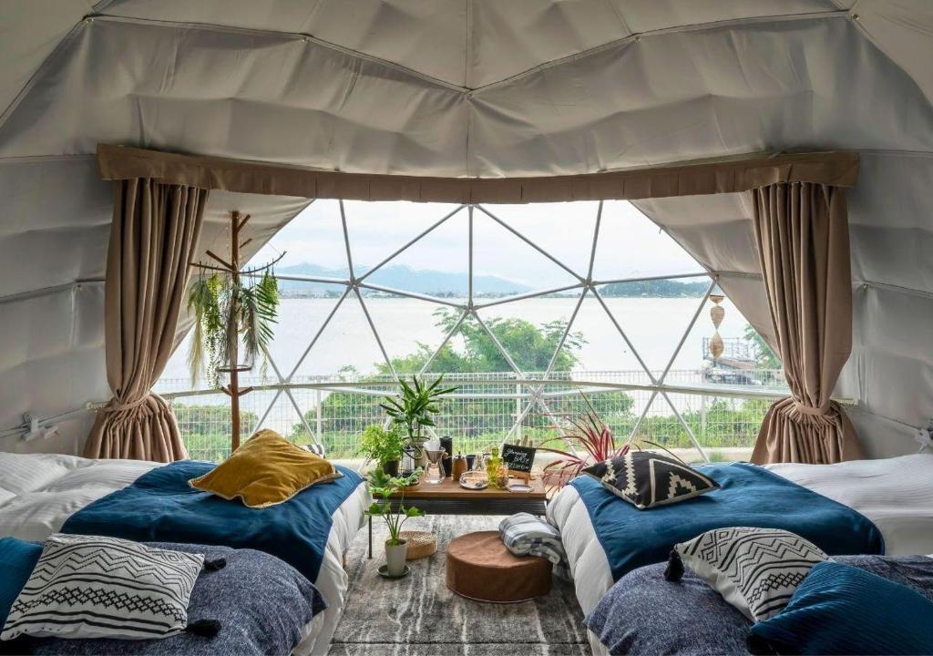 Et opholdsområde på Glamping Base IZUMO "Lakeside Hot Spring Hotel Kun - Vacation STAY 42018v