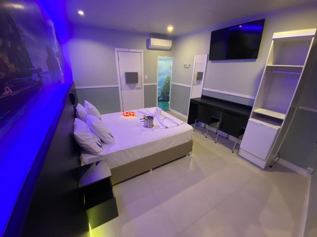 TV a/nebo společenská místnost v ubytování Único Motel Faria Lima