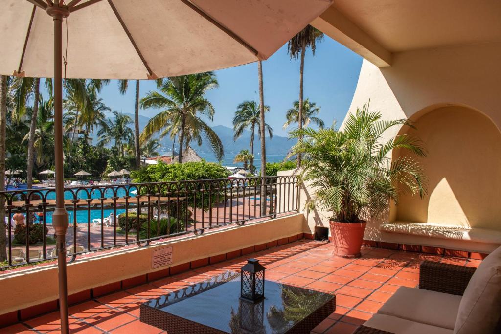a view of the pool from the balcony of a resort at Encantador Condo de 3 Recamaras en Velas Vallarta in Puerto Vallarta