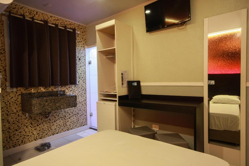 Postel nebo postele na pokoji v ubytování Único Motel Faria Lima
