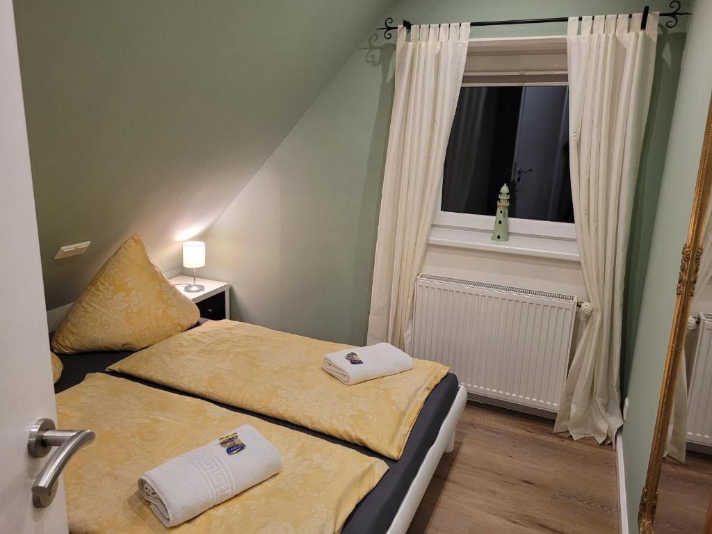 Postel nebo postele na pokoji v ubytování Ferienhaus Wind