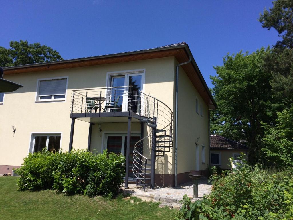 a house with a staircase on the side of it at Ferienwohnung Mayer in Rangsdorf