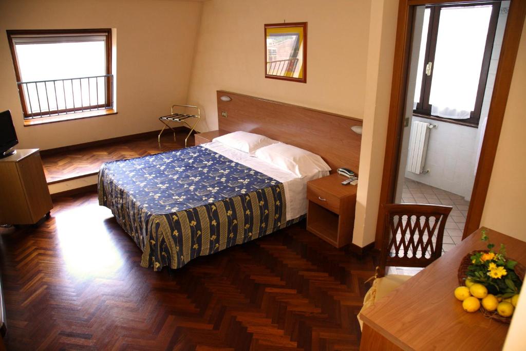 Postel nebo postele na pokoji v ubytování Hotel Del Sole