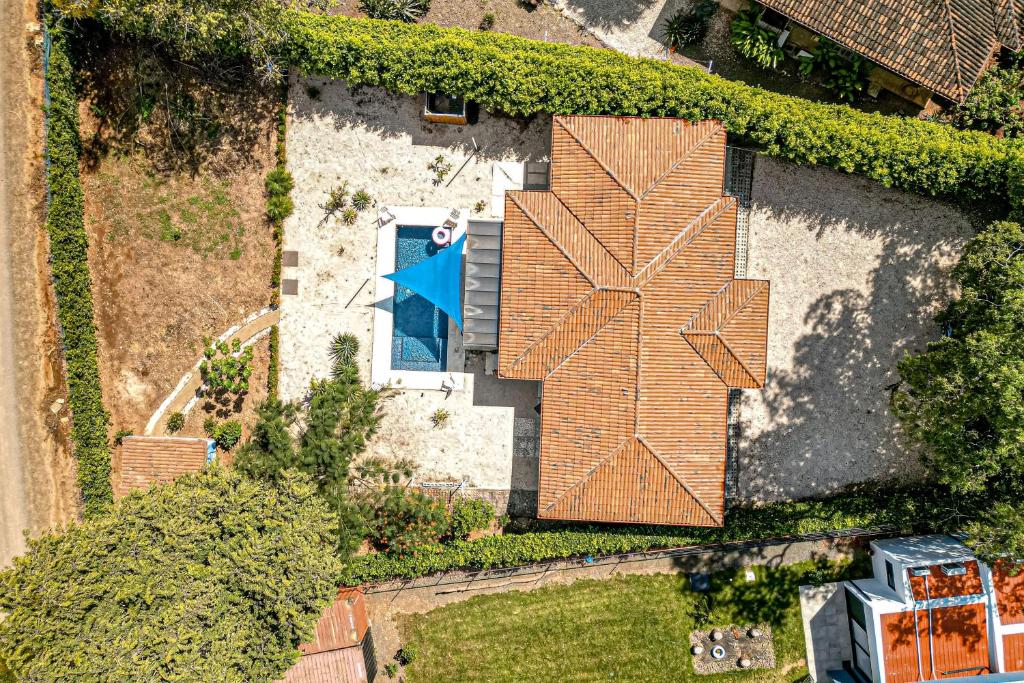 an overhead view of a house with a roof with a pool at Casa El Sueño in Brasilito