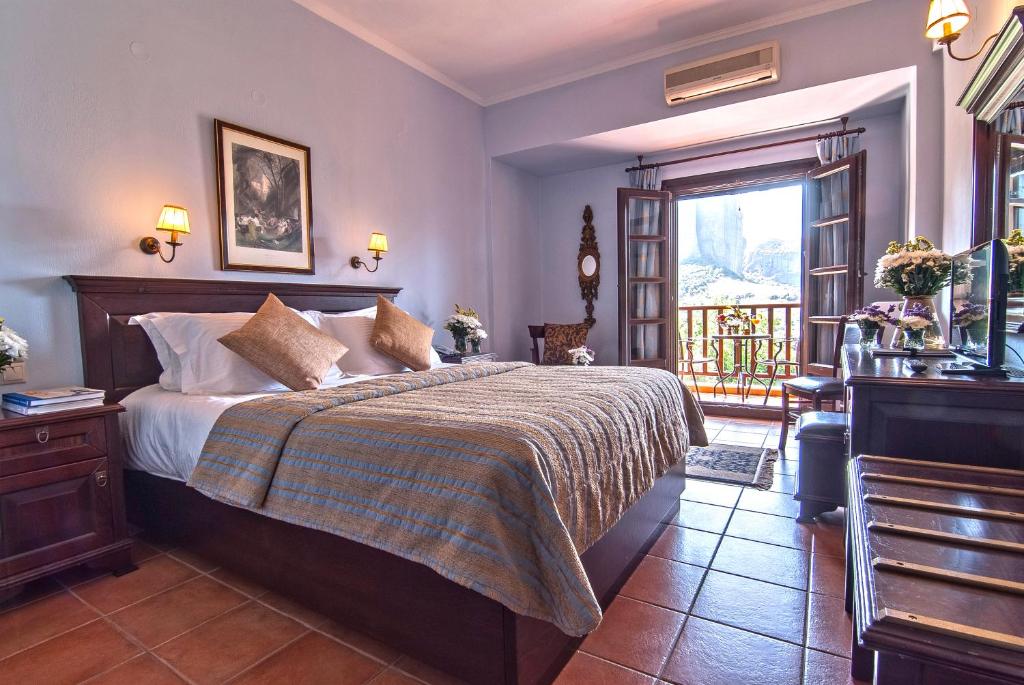 Postel nebo postele na pokoji v ubytování Hotel Doupiani House
