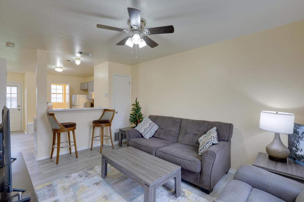 a living room with a couch and a table at Quaint Killeen Vacation Rental Near Shopping! in Killeen