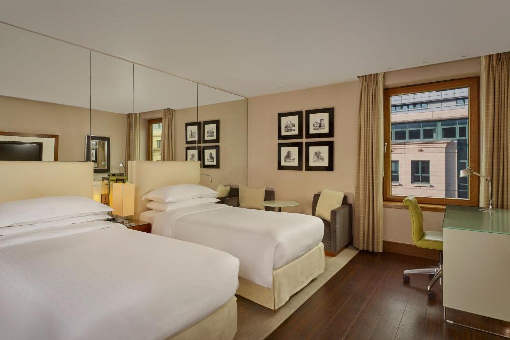 Postel nebo postele na pokoji v ubytování Sheraton Grand Hotel & Spa