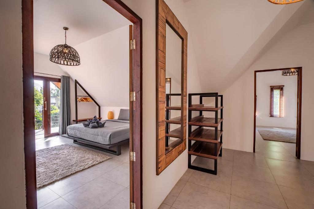 Ein Bett oder Betten in einem Zimmer der Unterkunft Coco Lilly Villas