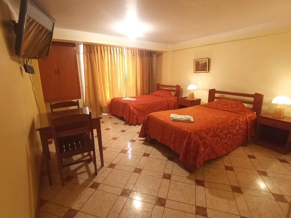 Postel nebo postele na pokoji v ubytování Hostal Cusco Inn