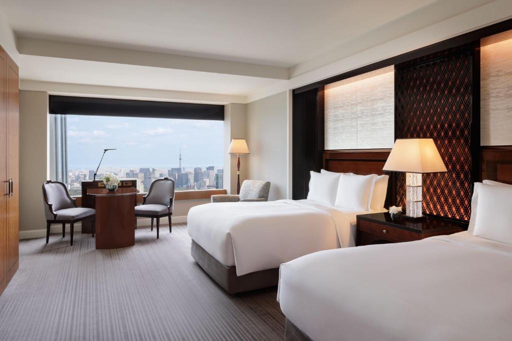 Postel nebo postele na pokoji v ubytování The Ritz-Carlton, Tokyo