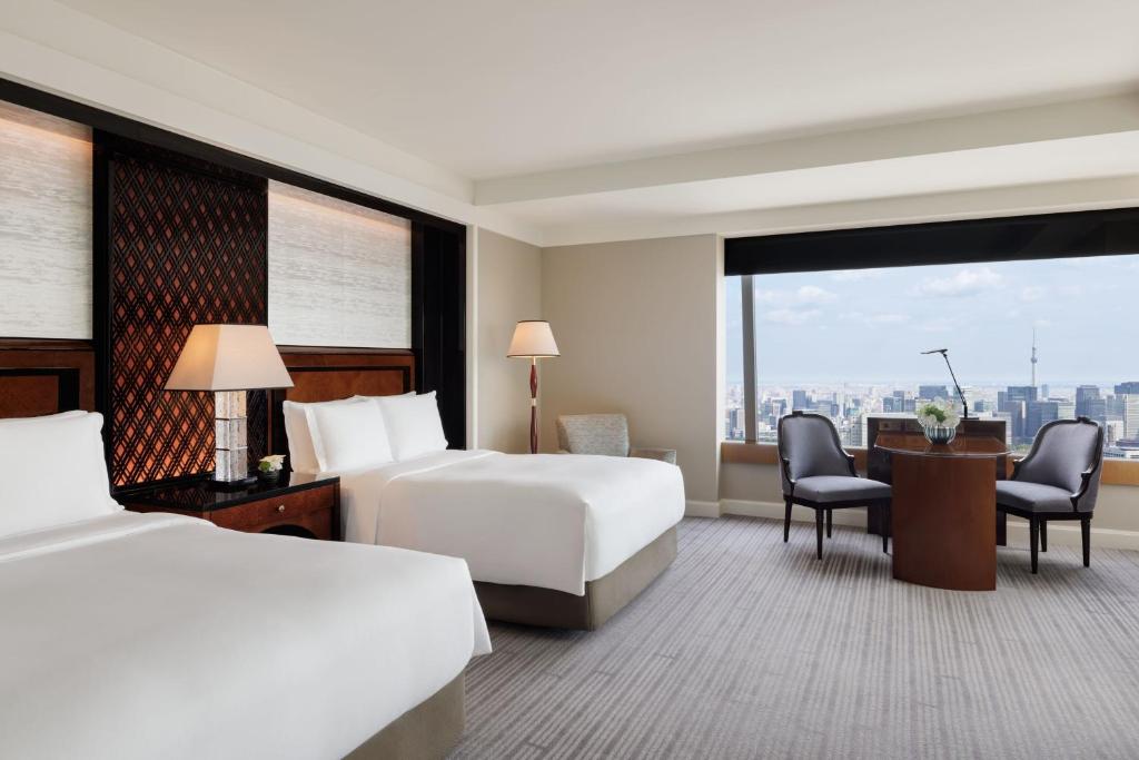 Postel nebo postele na pokoji v ubytování The Ritz-Carlton, Tokyo